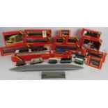 A large quantity of Hornby 00 gauge railway carriages, track, rolling stock, buildings,