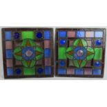 Two antique stained glass panels, each with a central quatrefoil. 45cm x 45cm. (2). Condition