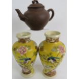 A Chinese Yixing teapot with lid, relief moulded with bamboo decoration, impressed mark to