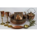 Mixed copper and brassware including a large planished bowl, a heavy antique kettle, two mugs,