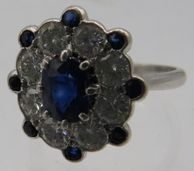 A superb 18ct white gold cluster ring set with centre sapphire, approx 8mm x 6mm, surrounded by 8