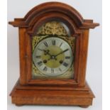 An oak cased mantel clock with striking and chiming German movement marked CB (Badische-Uhrenfabrik)