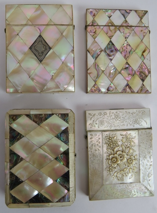 Four 19th century mother of pearl card cases, one with carved decoration, one with white metal