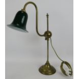 A brass rise and fall desk lamp with swan neck sconce and green glass shade. Max height 67cm.