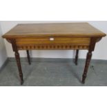 An Aesthetic Movement walnut side table in the manner of Debenham & Hewett, the under-frame with