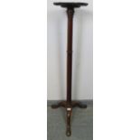 A 19th century mahogany torchere with piecrust edge, over a tapering plain column, the outswept