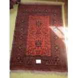A mid 20th century Persian rug central pattern on burnt umber field with wide borders, 180cm x