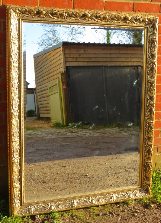 A large rectangular gilt framed bevelled wall mirror with moulded surround in the Art Nouveau taste. - Image 2 of 2