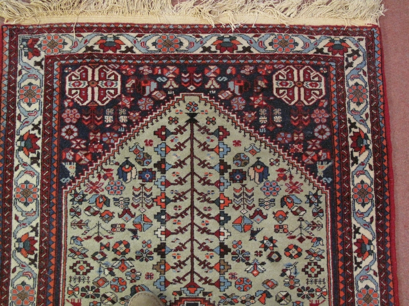 A Persian rug, 20th century, decorated with a central lozenge medallion amidst stylised motifs and - Image 3 of 5