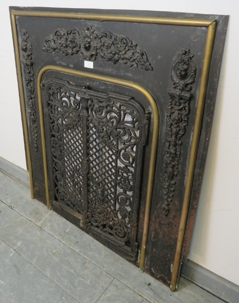 An antique cast iron and brass fireplace insert, the applied decoration depicting scrolling acanthus - Image 4 of 4