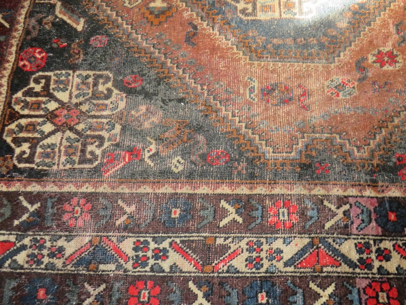 An early 20th century Persian rug (hand made in Iran). Central diamond pattern on fawn ground with 4 - Image 3 of 3