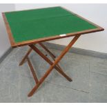 A 19th century mahogany folding campaign card table, with cast iron fittings, the canvas straps
