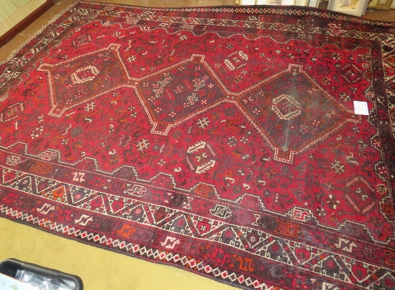 A mid 20th century Persian carpet. 3 repeat central motifs with stylised birds on a claret field. - Image 3 of 4