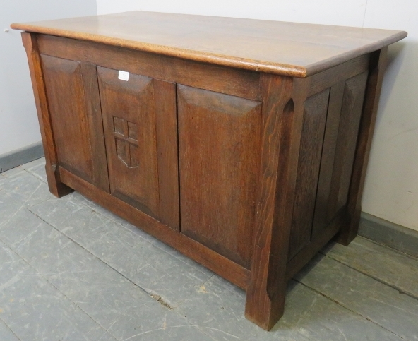 An Arts & Crafts oak coffer with fielded panels to all four sides and a relief carved shield to - Image 2 of 3