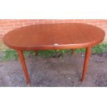 A mid-century Danish teak oval draw-leaf extending dining table, with two additional leaves, on
