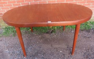A mid-century Danish teak oval draw-leaf extending dining table, with two additional leaves, on
