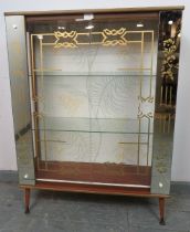 A 1950s mirrored glazed display cabinet, housing two loose glass shelves, on dansette legs.