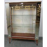 A 1950s mirrored glazed display cabinet, housing two loose glass shelves, on dansette legs.
