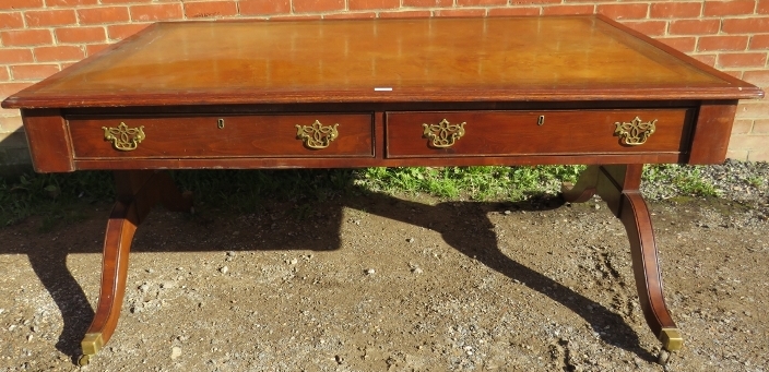 A large 19th century mahogany partners desk, with inset gilt tooled tan leather writing surface,