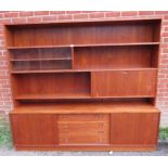 A mid-century Danish teak wall unit by Sejling Skabe, the top section with fall front bureau and