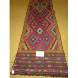 A Persian runner colourful diamond pattern. Good clean condition. 244cm x 58cm.