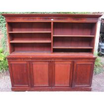 A very large Victorian mahogany bookcase, of four height adjustable open shelves above four cupboard