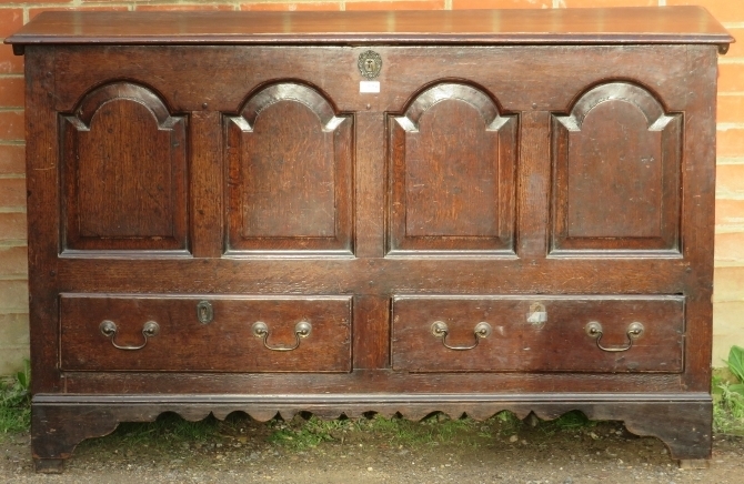 An 18th century oak mule chest, featuring an internal candle box with two small drawers under, the