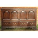 An 18th century oak mule chest, featuring an internal candle box with two small drawers under, the