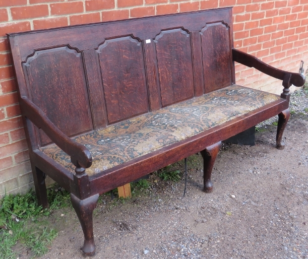 An 18th century oak settle, the backrest with fielded panels, joined with open-sided armrests, on - Image 2 of 2