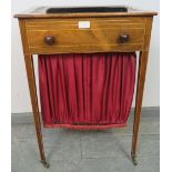 A Regency Period rosewood worktable, strung with satinwood, the rising bookrest top with inset
