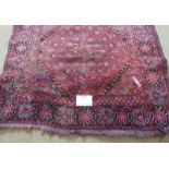 An early 20th century Persian rug, pale red - pink field , some wear conducive to age. 186cm x