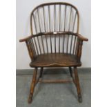 A good 18th century elm Windsor hoop back chair, on turned canted supports with an ‘H’ stretcher.