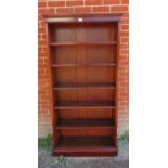 A Victorian mahogany tall open bookcase of five height adjustable shelves, on a plinth base.
