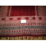 An early 20th century mid Persian rug/wall hanging with burgundy velvet panels. Measures 110cm x