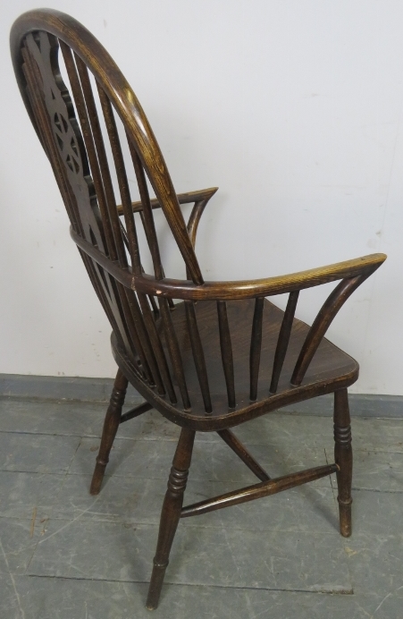 A Georgian elm wheelback Windsor armchair, on turned supports with an ‘H’ stretcher. Condition - Image 3 of 3