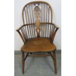 A 19th century oak and elm Windsor wheelback chair, on turned canted supports with an ‘H’ stretcher.