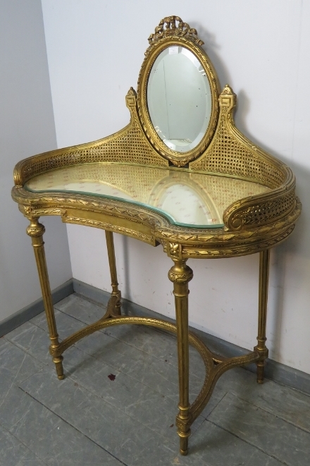 A vintage French giltwood dressing table, the double skin bergère gallery supporting a bevelled oval - Image 2 of 3