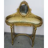 A vintage French giltwood dressing table, the double skin bergère gallery supporting a bevelled oval
