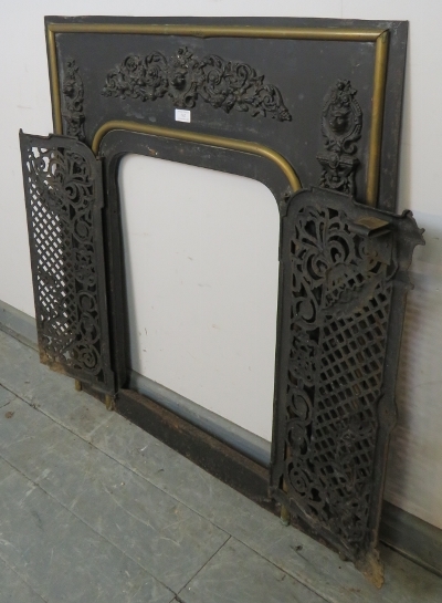 An antique cast iron and brass fireplace insert, the applied decoration depicting scrolling acanthus - Image 3 of 4