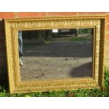 An 18th century style rectangular gilt frame wall mirror in a relief moulded surround depicting