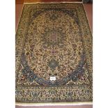 A fine Persian Meshed carpet, central pattern motif, blue on cream heavy pattern and wide borders.