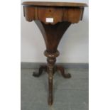 A Victorian rosewood trumpet/work table, the circular lid opening onto an array of lidded