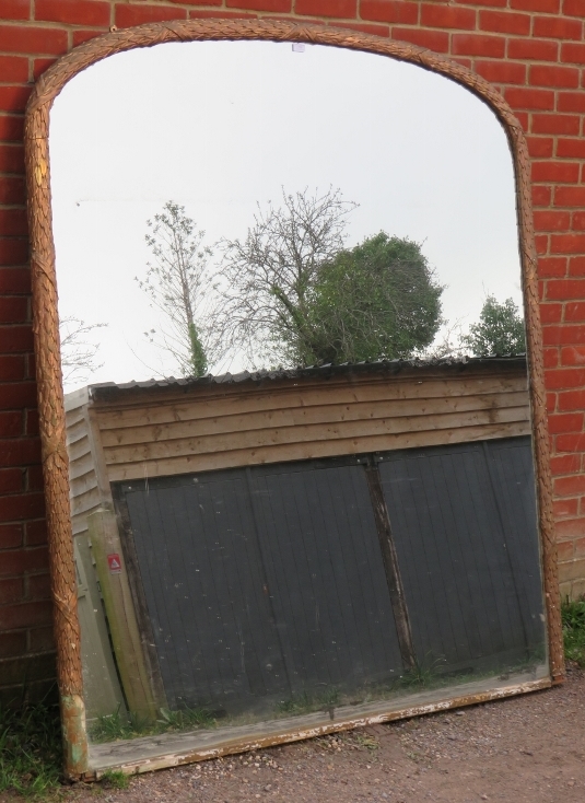 A very large 19th century arched overmantle mirror, retaining the original mercury glass plate, in a - Image 2 of 4