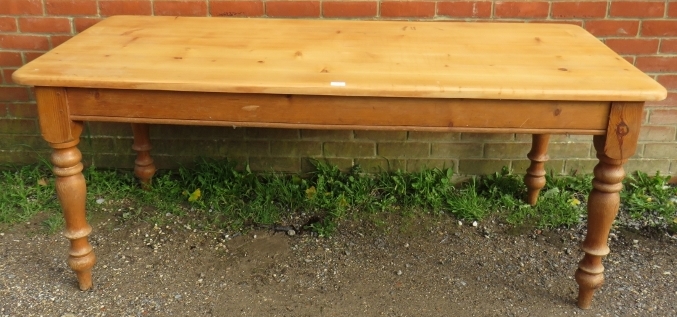 A vintage stripped pine country kitchen table, on baluster turned supports. Condition report: