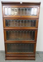A vintage mahogany Globe-Wernicke stacking bookcase of four graduated sections, the glazed doors