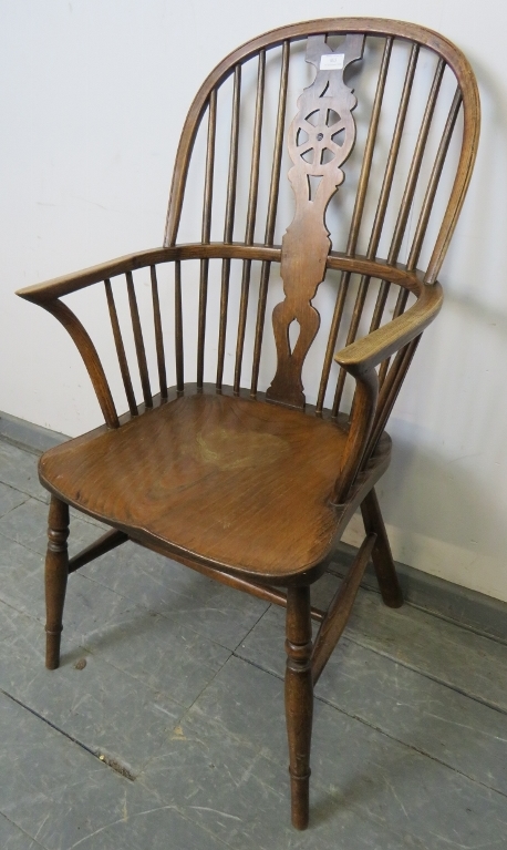 A 19th century oak and elm Windsor wheelback chair, on turned canted supports with an ‘H’ stretcher. - Image 2 of 3
