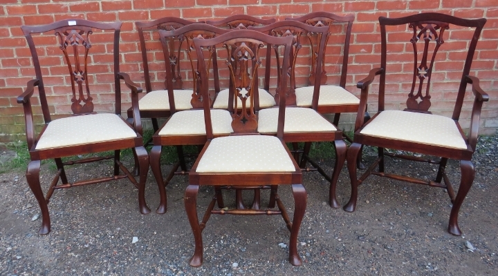 A set of eight (6+2) Edwardian Georgian Revival mahogany dining chairs with carved and pierced