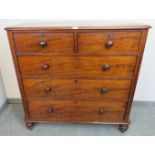 A Victorian mahogany straight-front chest of two short over three long cock-beaded drawers, on