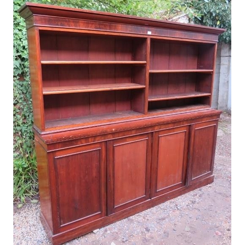 A very large Victorian mahogany bookcase, of four height adjustable open shelves above four cupboard - Image 3 of 3