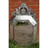 A large 19th Century Venetian mirror, with shell cornice amidst acanthus scrolls and sectioned